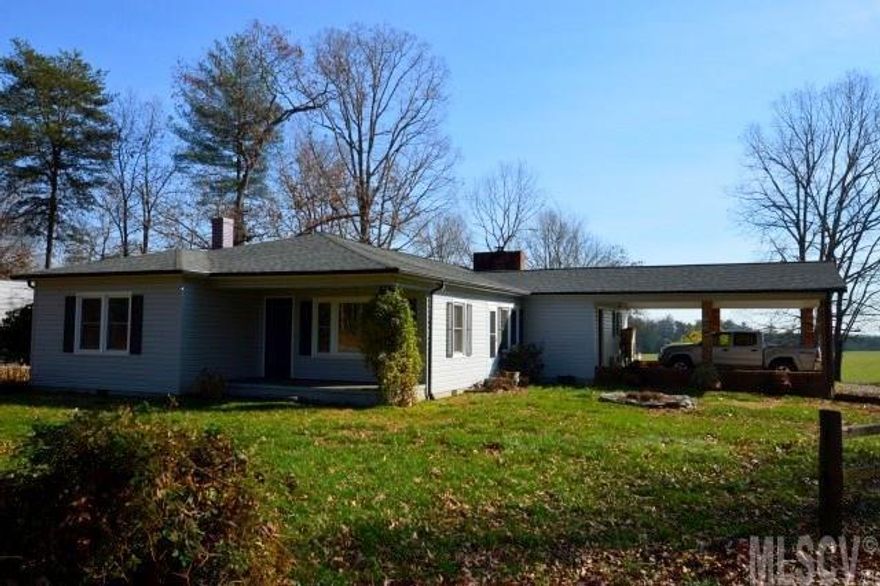 Great potential for a mini farm! This home sits well off the road and has a scenic pastoral view. There is a two stall barn with a tack room and electricity, and an outbuliding for additional storage. The home has a huge family room with gas log fireplace,  a very spacious master suite, and an oversized laundry room. The charming country kitchen comes with all the appliances. There is an attached double carport and a detached camper carport with electric hookup. The windows are about 3 years old, the vinyl siding is 5 years old, and the HP and roof were installed about 7 years ago. There is hardwood flooring in a bedroom and dining room. Located in the Baton community. No city tax!