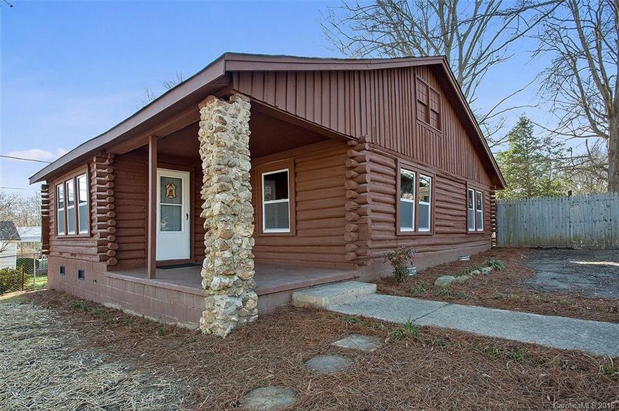 WHO WOULD HAVE THOUGHT you could find your own little "mountain" getaway in West Gastonia?  Charming log cabin with all-wood interior, brightened by plenty of large windows, all new! The roof was also replaced in 2015. New furnace 2016!  Nothing left for you to do but move in and bring your rocking chair for the front porch.  If you've ever dreamed of living in a log cabin and thought you couldn't afford it, this is your chance!