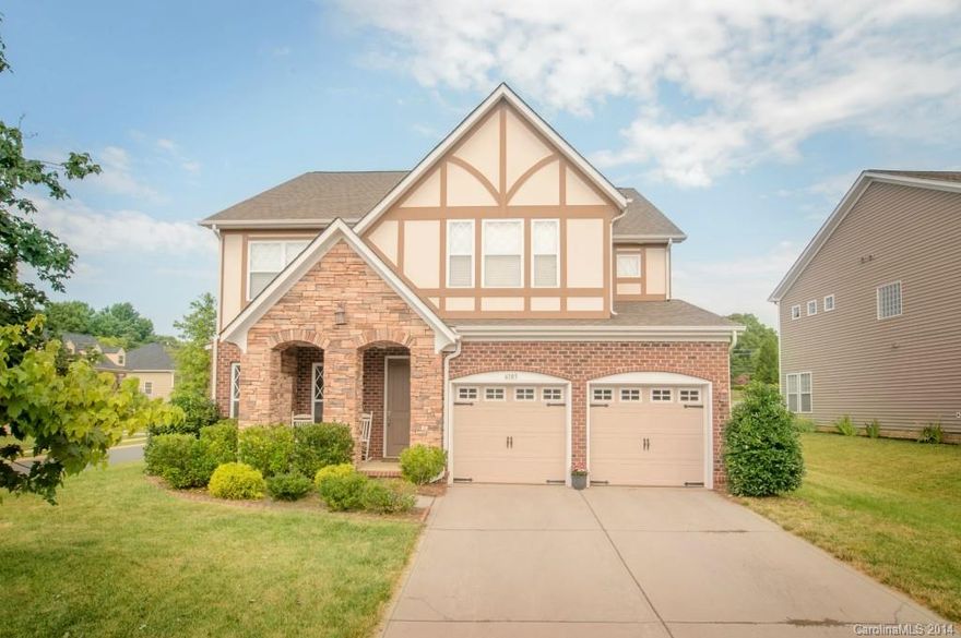 Superior construction & design in beautiful Berewick. 4bedroom with Master Bed on main floor offers one of the neighborhood's best finishes & design. Tudor-style front elevation. Great Room w/ soaring cathedral ceilings. Spiral staircase to second story. Multiple bay windows. 5" Hickory distressed hardwoods. Resplendent Kitchen w/ castled cabinets, granite counters, double oven, stainless appliances & large island. Brick-paver patio w/ pergola and fenced yard. Dual, carriage style garage doors.