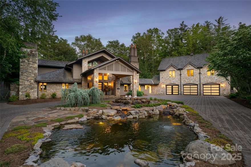 Discover unparalleled serenity with this private estate nestled on over four acres of curated gardens, open meadows and fern-covered forests. This enchanting property features a storybook conservancy, two charming guest cottages and an exquisite main residence. A stunning stone wall lines the property, ensuring privacy and creating an oasis that feels worlds apart—yet it's conveniently located 15 minutes from the heart of downtown Asheville. Situated within the prestigious gates of The Ramble, this estate offers a rare opportunity: the privacy and security of a gated community without the architectural or usage restrictions and currently no rental restrictions. The main residence is the ultimate mountain retreat, showcasing soaring post-and-beam ceilings, dramatic floor-to-ceiling stone fireplaces, an exquisite primary suite, a chef’s kitchen, five guest suites and over 2,000 square feet of outdoor living space with forest views. The main residence was meticulously renovated in 2022.