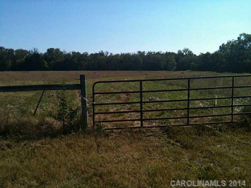 Gorgeous "flat" fenced pasture land, with stream. Wow! What a place to build your dream home.