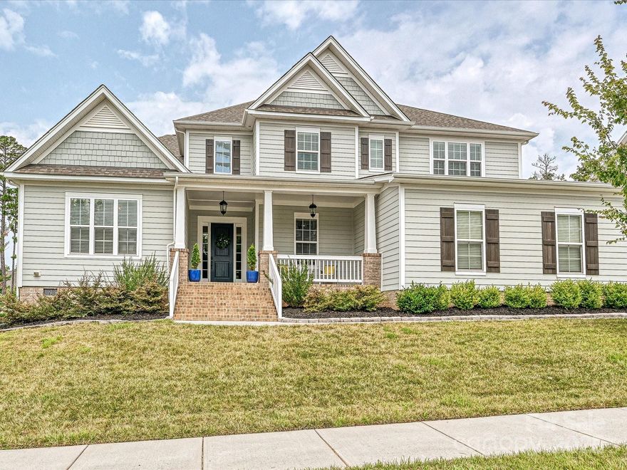 Bright and stunning home in The Enclave at Massey! Built in 2021 situated on a .38-acre lot, this 5-bedroom, 4.5-bath home offers an inviting front porch and an open floorplan filled with natural light. The gourmet kitchen boasts a large island, gas cooktop, and custom walk-in pantry, seamlessly flowing into spacious living and dining areas. Enjoy the screened-in porch overlooking the private, fenced backyard. The main-level primary suite features a spa-like bath with a walk-in shower, standalone tub, dual vanities, and dual walk-in closets. A guest suite with ensuite bath on the main floor doubles as a perfect home office. Upstairs includes three generous bedrooms, two full baths, a bonus room, and walk-in storage. Enter & exit through drop zone leading to attached 3 car garage and additional 4th garage great for parking or storage! Conveniently located near Fort Mill schools, shopping, dining, and more!