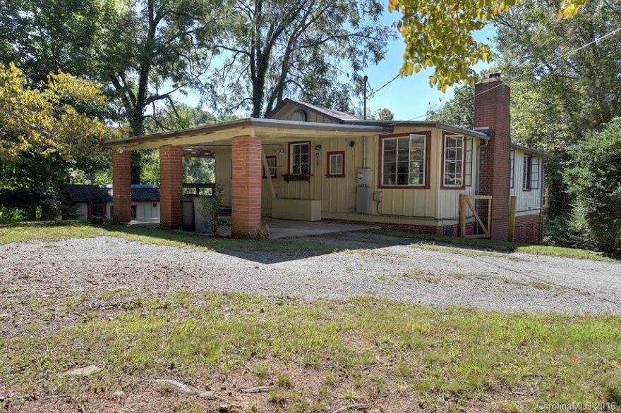 NEW WINDOWS installed on the main level of this charming 2BR/2BA home. Main floor offers an open floor plan with a charming breakfast area with a fireplace and an office or possibly small 3rd BR. Lower level features 2 bedrooms, a full bath, and a gathering room w/wood burning stove. Outside features include a nice deck and a large fenced in yard.  The home is conveniently located within approximately half a mile from downtown Waynesville.