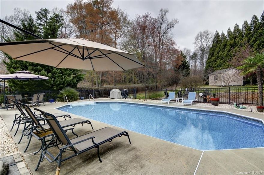 Enjoy the inground pool or relax on the patio or large deck overlooking your private back yard! This is your on private retreat so close to everything. Minutes from I-77, schools, shopping & more. New windows, HVAC and flooring. Brick fireplace with gas logs in cozy family room opens to dining room. Kitchen features stainless appliances, granite countertops & breakfast nook. Large master and bonus/bedroom plus 2 additional bedrooms. Well cared for and beautifully landscaped. Ready to call home.