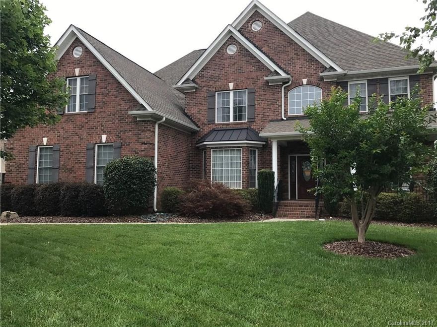 Gorgeous brick home, beautiful hardwood floors, amazing gourmet kitchen with huge island, formals, large first floor office, exercise or bedroom, dual wood staircases, wonderful master retreat, master bath has soaking tub and big shower, walk in closet has custom shelving, big bedrooms, one with its own full bath, massive bonus room with wet bar, huge 3 car garage with cabinets, beautiful and relaxing covered porch with fireplace overlooking golf course, outdoor kitchen, fire pit, fenced yard,