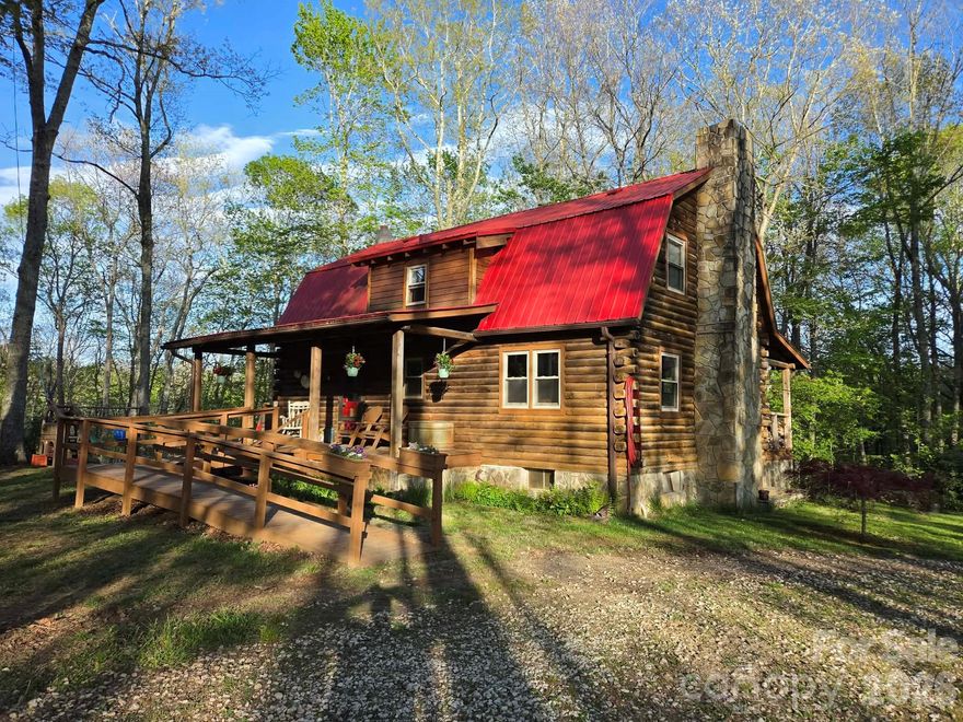 Beautiful log home with mountain views set back in the woods on just over 3 acres. The home has 3 bedrooms upstairs with a full bath, and a fully finished basement with an outdoor entrance and a full bath. Located in the basement are the laundry room, a freezer room with an included chest freezer, and a root cellar for cool storage. The kitchen and basement both have wood cookstoves. The living room has a wood stove for heating. There are also oil-fired monitor heaters in the living room, kitchen/dining area, and in the basement. The home is on great-tasting well water that is shared with another smaller home. Water rights will be included with the home.