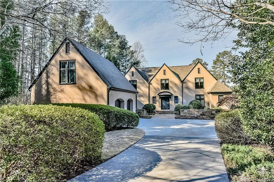 Exclusive Lake Norman estate with expansive long range views. Mature landscaping & wooded lot ensures absolute privacy. Well appointed exterior of hard stucco, natural stone & redwood trim with copper gutter system. Spacious open floorplan, two fireplaces, cedar closet, recreation rooms on the lower level & over the garage. Fabulous outdoor entertaining on the covered veranda, patio or lakeside sitting area. Private pier w/boat lift. Fantastic location near the new Langtree at Lake Norman.