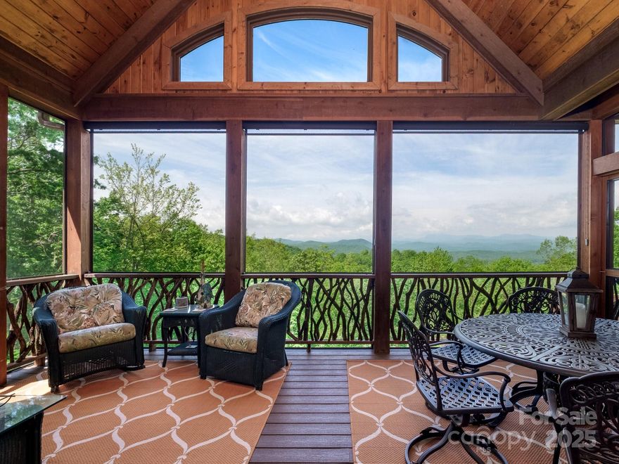 Built in 2007 by a premier custom builder, this home was designed as a true showpiece crafted with meticulous attention to detail. Inside, you’ll find high-end features including hickory floors with walnut inlay, triple tray ceilings, arched doorways, and rich custom woodwork. The spacious yet inviting layout includes multiple fireplaces, a luxury kitchen, large entertaining areas, a cozy media room, a guest suite, and a bright hobby space, offering comfort and flexibility throughout. What truly sets this home apart is the sweeping views and layered ridgelines with over 20 named peaks, from Toxaway Mountain to Sassafras, South Carolina’s highest point. Western sunsets and shifting seasonal vistas bring the landscape to life every day. Set on 1.5 acres at the end of a cul-de-sac, with total privacy and extensive landscaping and hardscaping. The home feels totally secluded, but you’re still just minutes from Connestee’s trails, courts, clubhouse, and amenities.