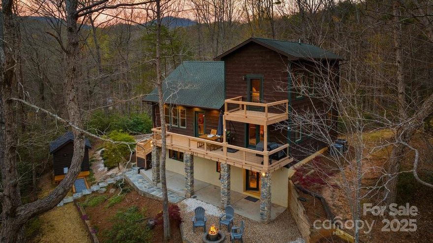 This 3 bedroom, 3.5 bath home is on beautiful Lake Lanier in Landrum. The kitchen has high-end appliances, farmhouse sink, quartz counters, & center island. Each of the bedrooms in this home has its own ensuite bathroom, spacious closets, and patio doors leading to a deck or patio. The 2 car garage also has a workshop- perfect for the hobbyist! Follow the stone pathway to the detached office complete with electric, internet & mini split. All appliances including refrigerator, washer/dryer, whole home generator, and Starlink internet convey! Home is wired for 3 types of internet & has a smart car outlet added for convenience! The adjoining property is a historic preservation that has structures that years ago was a Boy Scout camp. Trails that lead to the top of the Blue Ridge Mtns are 2 mins away at the Palmetto Trail. This property gives you the best of both worlds- lake life and mountain retreat living!