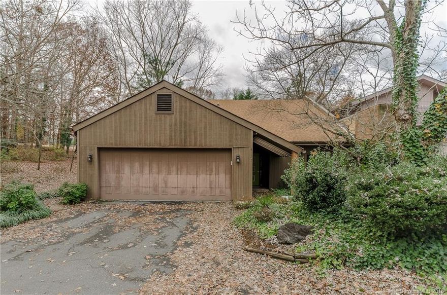 Excellent investment opportunity in Raintree. End unit on golf course. Very private location, lots of space. Two large exterior patios. Massive 2 car garage with extra storage and attic space above. Home needs work and updating but has loads of potential. Sold in as-is condition. Community features are part of Raintree CC private membership.