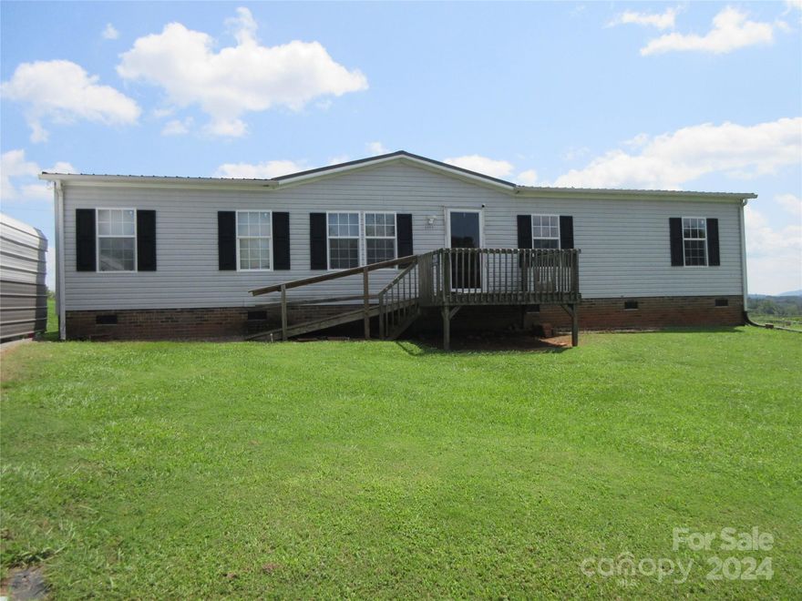 Welcome home! This home has 3 bedrooms, 2 bathrooms, plus Bonus/Bed flex space. The laundry room is just off the kitchen which leads to the backdoor. The Formal Dining room could be used as a Den and with a wood burning fireplace it makes this area a warm cozy spot for cool evenings. Outside there is a 2-car carport and extra parking. The back yard is level and spacious with beautiful view in the back. Some updates have been done including the guest bathroom, accent walls, some flooring and more. Call today for your private showing. The storage building does not convey but is negotiable!