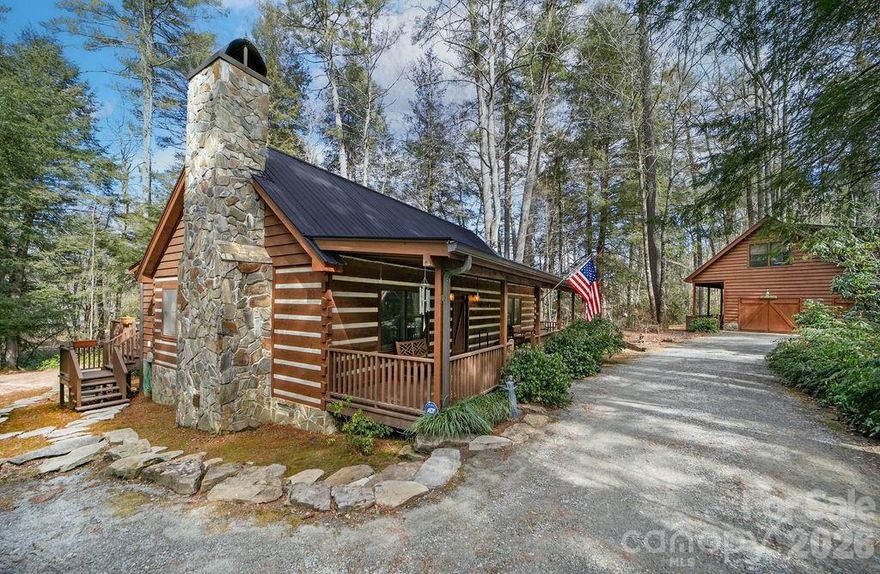 Welcome to 380 Cedar Lane, a rare and remarkable opportunity in the highly sought-after community of Cedar Mountain. Perfectly positioned along the iconic Little River—flowing directly into DuPont State Recreational Forest and creating some of the most majestic waterfalls in the region—this private mountain retreat offers an unmatched combination of natural beauty, flexibility, and freedom.
The owners of this home just installed a new metal roof, new gutters installed, new plumbing, new encapsulated crawlspace, new stone on chimney and more! The main residence features 3 bedrooms and 2 baths with an inviting open floor plan that creates a bright, comfortable living space ideal for gathering and entertaining. A cozy wood-burning fireplace anchors the living area, adding warmth and mountain charm, while the sunroom provides the perfect spot to relax and enjoy the surrounding natural beauty year-round. Large windows invite in soft natural light and frame peaceful woodland views. The functional kitchen offers ample workspace and storage, making everyday living both practical and enjoyable whether hosting friends or preparing a quiet meal at home.

Beyond the main home, the detached guesthouse/workshop expands the possibilities even further. This impressive structure includes 1 bedroom, 1.5 baths, and a large garage workshop space. Ideal for guests, hobbies, creative pursuits, or home-based business use, the layout also presents the potential to convert into a small independent residence with the addition of a kitchen. Whether you envision multi-generational living, rental potential, or a private studio retreat, the flexibility here is exceptional.

Adding to the property’s appeal: there are NO deed restrictions and NO county zoning—an increasingly rare find in Western North Carolina. This freedom allows for expanded use options, investment opportunities, or simply the ability to enjoy your property without unnecessary limitations.

Step outside and experience truly tranquil mountain living. The soothing sounds of the river and a babbling stream create a peaceful backdrop for everyday life. A charming gazebo and hot tub provide inviting spaces to unwind, entertain, or simply soak in the serenity of your private wooded acreage. Mature trees and natural landscaping enhance both privacy and the authentic mountain atmosphere.

The seller has already completed key improvements to make this an ideal year-round residence or vacation getaway, including the added convenience of a generator for peace of mind in any season.

Located just minutes from historic downtown Brevard, this property offers easy access to local shops, dining, music, and cultural events while maintaining a secluded, retreat-like feel. Outdoor enthusiasts will appreciate immediate proximity to hiking, biking, and waterfall exploration in DuPont State Forest. Asheville Regional Airport is within convenient driving distance, and Greenville, SC is also easily accessible—making travel simple while preserving your mountain sanctuary.

Offering privacy, versatility, riverfront beauty, and an unbeatable Cedar Mountain location, 380 Cedar Lane is a rare opportunity to own along the Little River in one of Western North Carolina’s most treasured settings.

See PROPERTY Video.