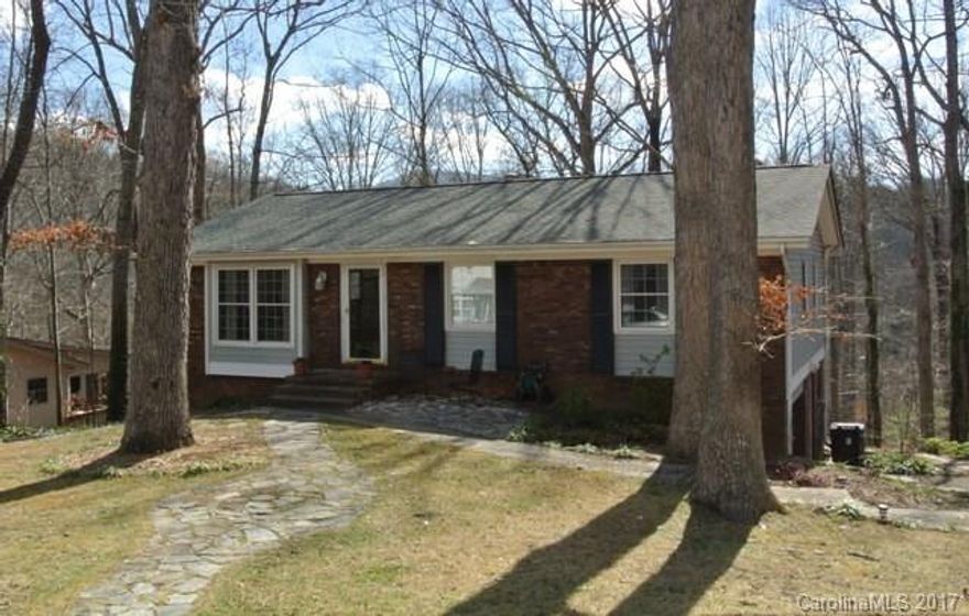 Great home in convenient, established East Asheville neighborhood on a cul-de-sac. Main floor has an open floorplan, dining room & kitchen w/ stainless appliances. Beautiful tile & wood floors throughout: herringbone oak in the master, parquet & bamboo laminate in remaining bedrooms. Cozy basement family room w/ gas logs. Enjoy spring on the the back deck or lower patio. Newer features include: architectural shingle roof, gas furnace (2010), gas hot water heater (5 years old) & paint throughout.