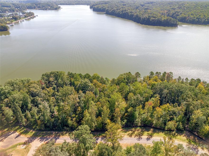 Waterfront and dockable homesite in McLean South Shore in Belmont NC on Lake Wylie. Lot 339 at 862 Lakeforest Drive is located on the main channel with views looking east. Gorgeous sunrises! A fairly level homesite, Lot 339 is located in a cul-de-sac. An incredible homesite indeed! McLean South Shore offers walking trails, clubhouse, outdoor pool, fitness center, playground. Carolina Thread trail along Lake Wylie located across New Hope Road. Within minutes of grocery shopping - Publix and Harris Teeter. Plus minutes from the walkable City of Belmont with its quaint vibe, festivals, park, playground, active train line - kids love watching the train, restaurants and shopping. The bustling Charlotte Douglas airport is about 15 minutes away for easy travel access. Uptown Charlotte, South Park and Ballantyne are commutable via nearby highways. Great small town location at doorstep of a bigger city! Premier waterfront community!