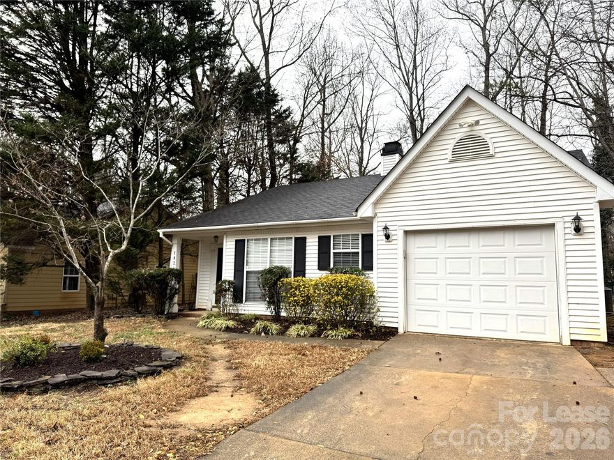 Welcome home! This quaint ranch-style home located in an established neighborhood near a cul-de-sac, offering a quiet setting with convenient access to Uptown Charlotte, shopping, and schools. The home includes three bedrooms and two full bathrooms, with a spacious primary bedroom featuring a walk-in closet and a private bathroom with dual sinks and a garden tub. Two secondary bedrooms share a second full bathroom, and brand-new vinyl plank flooring has been installed in all bedrooms. The dine-in kitchen includes a new Whirlpool dishwasher and a side-by-side refrigerator with a water and ice dispenser. A separate laundry room with hookups for tenant washer and dryer. Additional features include a one-car garage with remote door opener. Home is clean and move-in ready, offering practical living in a peaceful location. Tenant is responsible for lawn care and exterior maintenance. No pets and no smoking permitted.  Application is $50 per occupant age 18 and older. Call today to schedule a tour of this charming property!
