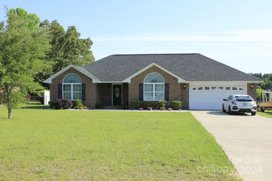 2665 Stirrup Ln is conveniently located 7 minutes from Shaw AFB, shopping, and restaurants. This ranch style brick home sits on an impressive 0.94 acre waterfront lot with a huge fenced in back yard and double patio. Inside, the home has vaulted ceilings with a spacious living room, kitchen, and formal dining room - all with engineered hardwood flooring and granite countertops. The large master bedroom has a raised ceiling and the master bath features a granite dual vanity with updated fixtures and cabinets. There are 2 additional bedrooms, another full bath, and a 2 car garage with interior storage room. The pond is stocked with bass and bream.