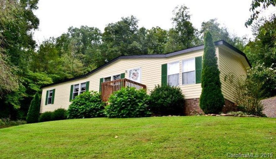 WELL MAINTAINED 2006 Horton Mobile Home Situated Perfectly in the desirable area of Old Fort.  Lots of Privacy & Located just 9 miles from Black Mountain and 9 miles to Marion this home is the PERFECT location for someone needing easy travel between McDowell and Buncombe County. Interior of the home features very open floor plan, wood laminate flooring, Living Room and Family Room. There is a split floor plan with Large Owner Bedroom Bath on one end of house and other two bedrooms located at opposite end. Call more for details. Don't miss out on the opportunity to be the Proud Owner of this exceptional home! New survey being completed