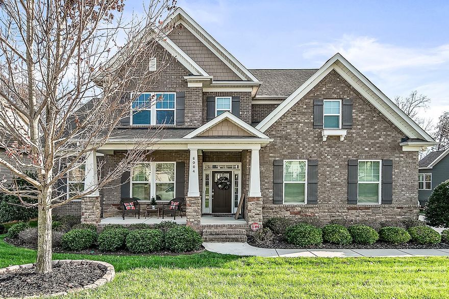 One of only a few FULL BRICK Exterior in the Subdivision. BRAND NEW ROOF! Custom trash enclosure storage for convenience from the 3 Car Garage. Gleaming Hardwoods, Wainscoting, and Wide Crown Moulding are just some of the Designer accents. The Chef will love the Gourmet Kitchen with the walk-in pantry, wall oven, gas cooktop and the farm sink at the oversized island. Open Floor Plan shows off the coffered ceiling in the Great Room with a gas fireplace. The Luxurious Primary Bedroom on Main boast of a beautiful ensuite bathroom with dual sinks, Garden Tub, enclosed tile shower and a Large Walk in Closet. Custom Drop Zone with bench seating and baskets. Loft at the top of the stairs is perfect for a study nook. The Huge Bonus Room or Bedroom 5 provide multiple usage. All Secondary Bedrooms have Walk in Closet. Tons of storage throughout! Enjoy the privacy and pretty view of the woods that lined the backyard. Irrigation and fenced yard. Stunning and Immaculate home in a Great Location!