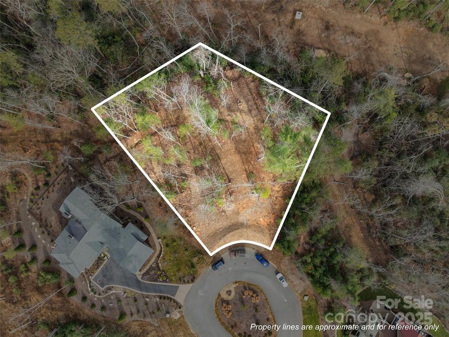 Surrounded by enchanting forests and creek cascades, this homesite offers a tranquil and private respite within The Ramble. With an ideal balance of nature, community, and location, this special property at the end of a private cul de sac offers quiet luxury near the heart of Asheville.  This gently sloping estate-sized homesite is surrounded by generous green space and the soothing sound of a natural cascading creek.  The Ramble offers parks, trails, security, gated entrances and a Living Well Center complete with a demonstration kitchen, fitness equipment and an outdoor heated saline swimming pool, bocci ball, pickle ball and tennis.