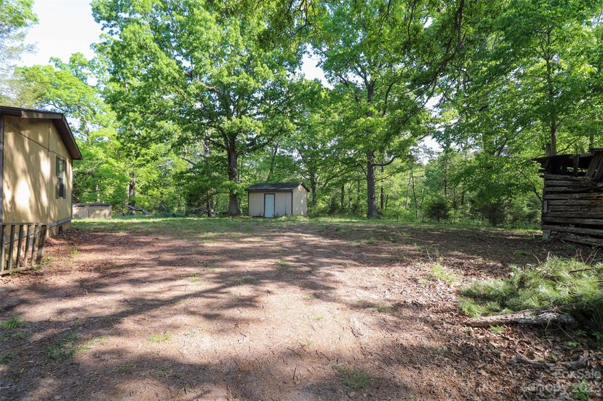 Many options in great location zoned LI Limited Industrial. 6.35 acre tract located just off US Highway 601 South in between Concord and Midland. Manufactured home and systems on site being sold as is with no consideration. Home could be rehabbed to be used as an office. City water located at main highway. Home is serviced by a well and septic. Use extreme caution on home decks. No septic permit on file with Cabarrus County. Access is from Hwy 601 via old farm road. No ROW deeded but access cannot be denied due to road being used over 100 years to access land.