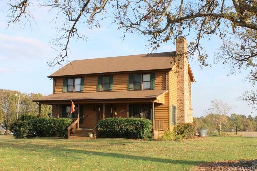 Just Reduced & $3500 in closing cost with acceptable offer! Well-maintained 2-story home with basement on 3 beautiful acres & 100+ yr. old oak trees. Ideal garden area/possible horse farm-just mins to Monroe. New Roof '11. Large front porch, spacious rooms, open living area w/lots of windows and gas-logs /Fpl in GR  .  Updates: kit with smooth profile c.tops, tile back-splash,  wood laminate flrs. on main.  BRs & GR w/ updated carpet. Basement/Game Rm w/wood burning Fpl. 2-car garage & 3 carport