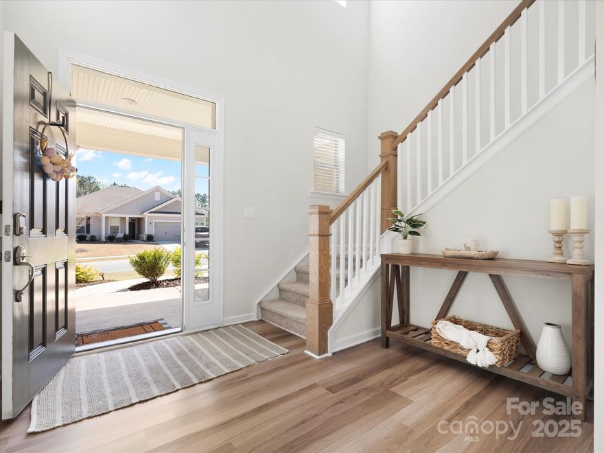 This home offers a thoughtful layout with versatile spaces designed to fit your lifestyle, all set on an oversized lot. As you enter, you're welcomed by a dramatic two-story foyer that leads into a spacious great room and dining area, seamlessly connected to the island kitchen. The kitchen is a chef's dream with ample cabinetry, a large corner pantry, and a dedicated work center for extra storage and home organization. Whole house water filtration system. Guests will appreciate the privacy of the downstairs guest suite. Upstairs, you'll find a loft area that serves as a perfect second living space. The private owner's suite boasts a generously sized bath with dual sinks and a separate water closet, along with an expansive walk-in closet just off the bath. Two additional bedrooms offer plenty of closet space and share a large, well-appointed bathroom. This home has everything you need for comfort and convenience, plus a huge yard for outdoor enjoyment.