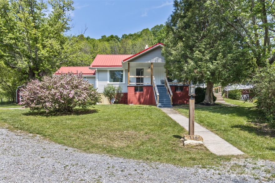 Is it a cottage or a farmhouse? Who cares?! It's a beautiful transformation of this Cruso creampuff! The end result is a free flowing, 2 bed 2.0 bath beauty with 1,390 sq ft that will check all the boxes for several different types of buyers. Updates include new flooring, walls, remodeled baths/kitchen, mini-split heating/cooling, paint, etc. You'll love the eclectic but tasteful finishes that are so warm and bring a smile to your face. BIG 2-car detached garage, front & back porch, back & side deck, and plenty of storage in the shed/small barn. Did I mention the breathtaking mountain and pastoral views, creek running adjacent to the property, easy access to/from Cruso Rd, and close proximity to downtown Canton AND Waynesville and great golf at Springdale Country Club? This is a one of a kind in Cruso that you need to see to appreciate. Perfect for a vacation rental, 2nd home, retirement home, or even first timers. Check out the drone footage and "The Scoop" for a list of renovations!
