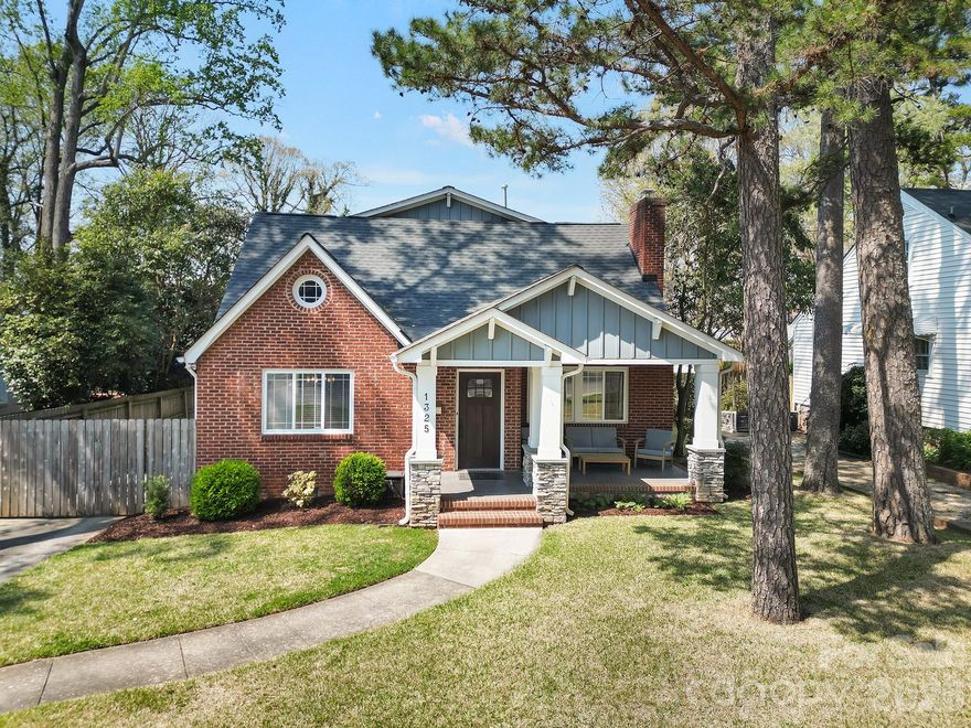 Charming Craftsman style home in a prime Charlotte location just minutes from Uptown and steps from Plaza Midwood. Covered front porch welcomes you inside a thoughtfully renovated interior that blends classic character with modern finishes. Real hardwood floors extend throughout the entire house, complemented by neutral tones, updated lighting, and whole home blinds. Gourmet kitchen has been beautifully updated with Shaker style cabinetry, subway tile backsplash, Bosch appliances, generous island with seating, and breakfast nook perfect for enjoying your morning coffee. Adjacent dining and living rooms offer an open floor plan layout for both everyday living and entertaining. Three bedrooms on the main level, along with a full and half bathroom, provide flexibility for guests, office space, or playroom. Upstairs, the primary suite offers a private retreat with tray ceiling, hardwood floors, dual sink vanity, soaking tub, oversized shower, and walk-in closet with built in shelving for enhanced storage. Additional bedroom with an en-suite bathroom, and spacious laundry room complete the upper level. Backyard features a fully fenced and usable outdoor space with an electric gate, paver patio, and two car detached garage. Ideally located near Veterans Park, offering a playground, tennis and pickleball courts, soccer and baseball fields, disc golf and splash pad. Just moments from popular dining, breweries, coffee shops, and grocery stores. Convenient access to I-74 and Interstates. This home delivers an exceptional balance of location and style.