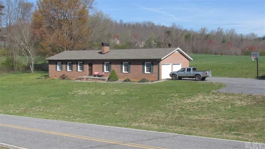 Immaculate three bedroom home on 2.15 acres in the Ellendale community of Alexander County. Framed in a beautiful pastoral setting, this stick built home is move-in ready. In addition to central air, it features a unique hot water heating system that is fueled by propane. Everything is on one level, which makes maneuvering a breeze. The laundry area is just off of the kitchen; out of the way, yet handy. The carpet was installed in 2009. The interior was painted just  this year. The fixtures were updated in 2015. The kitchen is spacious with plenty of cabinets for storage. Outside we have a 10 x 12 storage building that adjoins a fenced dog lot. A lovely grass field is on the balance of the 2 acres. The attached garage features a pair of roll up doors and the paved parking area has a basketball goal for practicing those jump shots. This property also includes its own well for a water supply. If you are looking for a peaceful country setting with a spacious home, this may be the one.