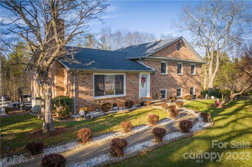 This is what you have been looking for. Well maintained home on 6 plus acres. Full brick, vinyl replacement windows and new roof... 4 bedrooms with 3 full baths. Lots of natural light in the living room with fireplace, well-appointed dining room and a kitchen with everything you need, even a eat at bar.  Enjoy the large family room with cozy warm burning wood stove and French doors to outdoor patio. Loads of storage in the laundry room or basement garage. The outside has a beautiful yard with mature landscaping, fruit trees, organic garden and green house.  Also included is a 22x32 detached block garage /workshop. Garage is spacious and has a woodstove. Best place ever to hang out. Enjoy all the trails in the woods behind. Peace and quiet is waiting for you.