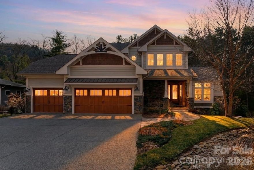 Experience the pinnacle of Asheville luxury in this exquisite custom home, perfectly situated within the prestigious gated community of Town Mountain Preserve. Designed for the discerning homeowner who seeks a harmonious blend of privacy, nature, and proximity, this residence offers a secluded sanctuary just minutes from the vibrant culture of downtown and the premier conveniences of North Asheville. Rarely does a mountain property offer such effortless connectivity; this community features dual-gated access points that provide a strategic advantage for daily living. Use the southern entrance for immediate access to Downtown Asheville’s world-class culinary scene, art galleries, and boutiques, or utilize the northern gate to connect seamlessly to North Asheville’s upscale shopping, organic grocers, and excellent dining. Tucked away in a quiet, wooded environment, yet never more than a short drive from the city’s heart. This home is a masterclass in architectural balance, merging contemporary elegance with timeless mountain charm through custom high-end finishes that elevate the living experience throughout. The thoughtful floor plan is designed for both comfort and entertaining inside and out, featuring a spacious main-level primary suite and oversized garage for effortless accessibility. The upper level boasts a second primary suite and a well-appointed guest room, while the terrace level provides a private fourth bedroom and versatile living space. While the kitchen offers a tasteful and functional heart to the home, a true showstopper is the dedicated theater room perfect for hosting unforgettable evenings.This mountain property features a private park-like setting complete with a custom firepit for gathering under the stars. This residence caters perfectly to those looking for a permanent "forever home" or those searching for a high-end mountain escape, offering a lifestyle defined by quality, tranquility, and the natural beauty of Western North Carolina. From the sophisticated security of a gated woodland retreat to the unparalleled privacy of its quiet lot, this home represents the very best of the Blue Ridge lifestyle, ensuring you are close to the action yet worlds away from the noise.