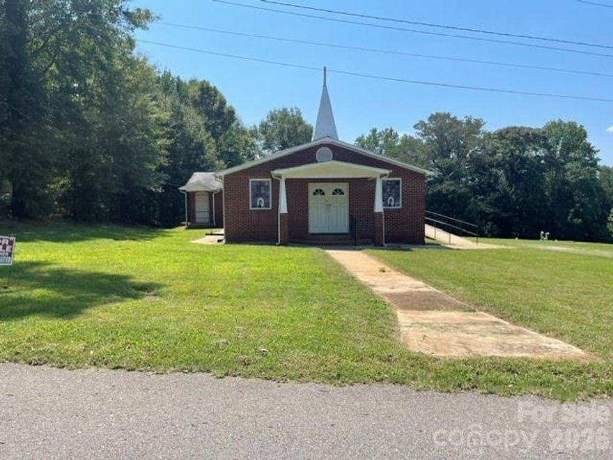Great versatile church building with potential for upgrading or possible other use. The current sanctuary comes with 26 pews, A/V equipment, and baptism pool. Additional spaces include 4 bathrooms, kitchen, and 2 offices. The exterior features a ramp for easy access and plenty of spaces for parking on the ¾ acre lot. The cemetery next door is on a different lot and not included in the sale.