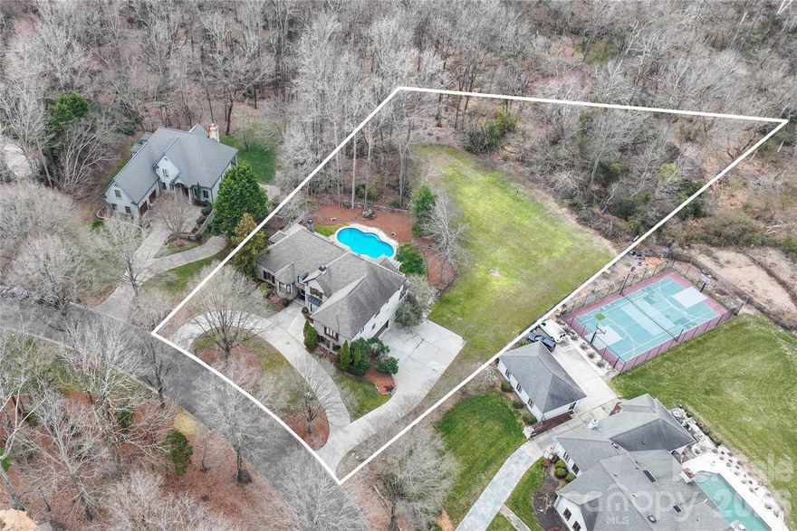 GREYSON MANOR
9529 Greyson Ridge Drive · Charlotte, NC 28277 · $2,150,000
Nearly 7,660 SF · 1.27 Private Wooded Acres · 6 Bed · 7 Bath · No HOA

 The owners made a strategic decision to prioritize timing over price maximization. Deliberately letting the heir inherit the upside.  
   Comparable homes are half the land and half the square footage for double the price merely because they might be dressed in more recent fashions. Making Greyson Manor not only the rarest luxury offering in South Charlotte right now, but for the buyer who understands the irreplaceable nature of these solid fundamentals, it may be the single finest value proposition this corridor has produced in twenty years.
 The house did not become less rare. The entry point simply became more intelligent.

Most luxury homes demand inflated prices because they are fashionable. A prized few are valuable because they are irreplaceable.
Buyers who chase fashion run in place. You can re-style a bathroom or update a kitchen. You cannot update geography. Buyers who understand legacy, invest in what can never be replaced.

Fashion is a subscription. Fashion fades. Legacy is a deed. Fundamentals are forever.

Most homes are decorated. Greyson Manor was custom built, and built exceptionally solid. The stone is structural. Full Arriscraft castle-cut stone and castle brick from foundation to roofline (not a veneer). Hand-carved Brazilian walnut wide-plank floors from Amish masters whose mastercraft retired with them. These are not floors. They are heirlooms.
   1.27 acres is sovereignty. Multiple fireplaces. A chef's kitchen with five-burner gas range. Four upper suites. Stately library. Impressive home offices with built-in shelves. Rooms for yoga and meditation. Arts and crafts area.
A fully self-contained lower level with a secondary kitchenette. in-law suite, wet bar, billiards, screened porch to pool - an estate within the estate.
Main-level primary suite with balcony overlooking the pool and protected forest
A nature reserve borders the entire rear -no variance, no rezoning, no developer, no neighbor, ever. The view your children inherit will be identical to the one you see today.
Enjoy your coffee with deer in the morning. Relax with a cocktail by the pool in the afternoons. Sixteen minutes to Blumenthal Theater for a Broadway style show the same night.
Greyson Manor already elevates liveable to lovely, and needs nothing. Though, for those who may want to accent finishes to a an excpetionally elite level, a $100,000 budget would instantly have this home exceed $3,000,000 in value, with nothing more. This highly sought after area already supports over $7,000,000.
The math pays off either way - the choice is yours to be proud as-is, or exalt it to a Homearama finalist.

Three minutes to the Arboretum or Whole Foods. Eighteen to Uptown. Zoned for Providence High School, top 1% in North Carolina. No HOA. Influential neighbors.
Privacy here is not landscaping. It is geography. It is law. It is permanence.

The next owner of Greyson Manor will either be visionary… or simply faster.

Private appointments now available.