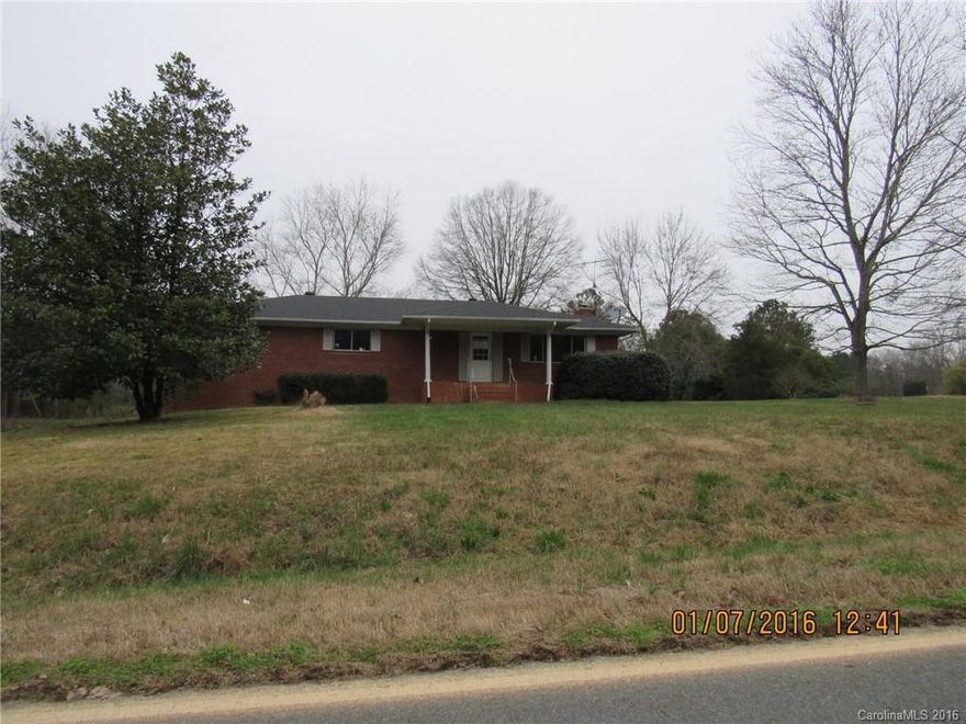 Country living found here with over 7 acres with pond. Full brick 70s ranch ready for updates has lots of potential with large kitchen, dining room with fireplace, 3 large bedrooms and 2 full baths up.  Apartment in full walk out basement needs mold remediation and should be viewed with care at your own risk.  Detached 1 car garage has extra storage room or shop area plus room for car. Buyers must have cash or prequalification for a loan to do basement repairs.