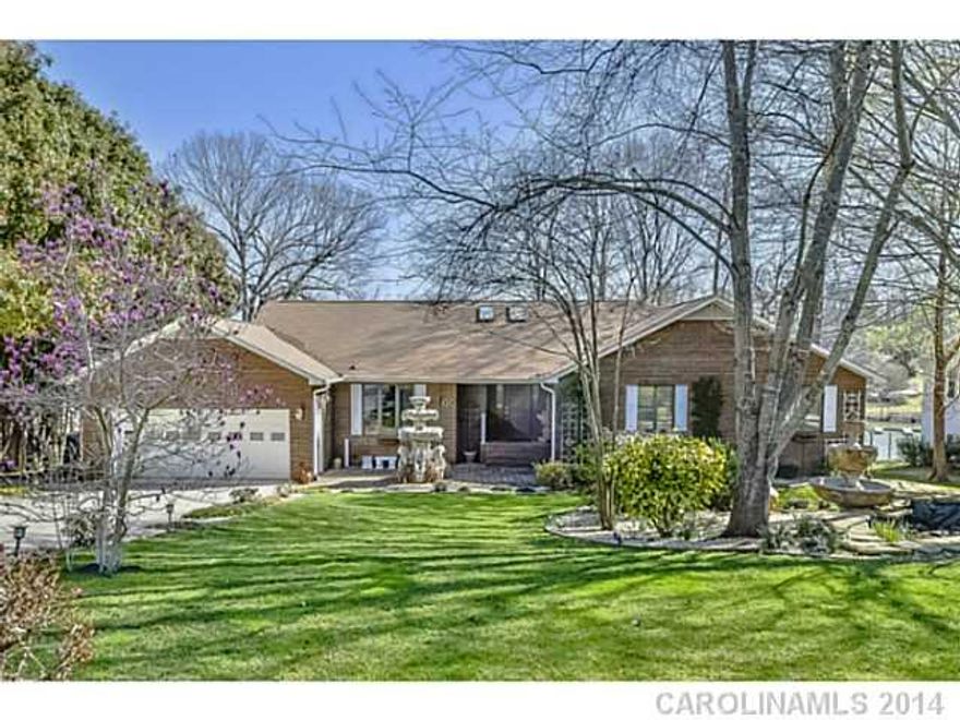 Stunning waterfront home w/private pier & floating dock! Beautifully landscaped yard w/fountains, waterfalls & lush greenery. Full brick basement home has been meticulously maintained! Hardwood floors throughout, moldings, formal dining, great room w/marble fireplace, large kitchen, master w/water views, finished basement w/2nd kitchen & water views. Vacation at home in this tropical paradise. County taxes only, no city tax.