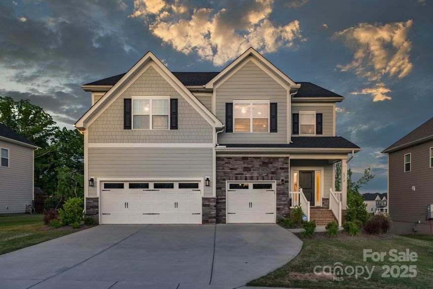 Stunning Stanley Martin Built 5-bedroom home+bonus room, incredible kitchen and luxurious features throughout. Inside, you're greeted by great room with recessed lighting and engineered hardwood flooring that flows throughout the main floor. The heart of this home is the kitchen, It features expansive island complemented by 42-inch cabinets, quartz countertops, herringbone design backsplash. Stainless steel appliances, including a 5-burner gas cooktop with hood, Soft-close drawers, pantry, and pendant lights add convenience and style.The main suite is a luxurious retreat, king-size bedroom, modern ensuite bath, and walk-in closet. Quartz countertops grace all the bathrooms. Laundry with sink for added convenience. Step outside onto the large Trex deck, complete with metal railing and a covered seating area. Privacy with arborvitae lining the sides of the yard and a wooded common area in the rear. Garage with an epoxy floor, a second utility sink, hanging cabinets, and an exterior door.