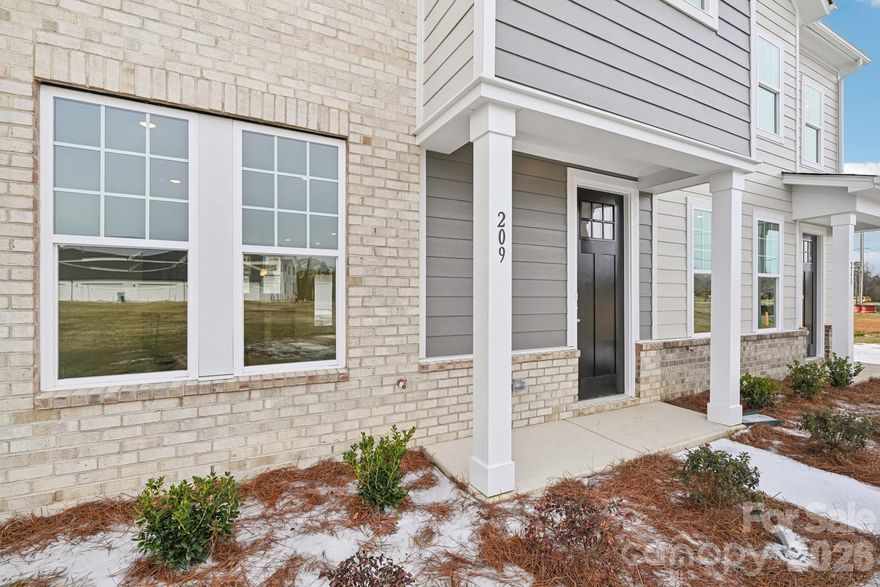 Welcome home to The Watkins, where modern townhome living meets comfort, convenience, and an unbeatable location in Cramerton, NC. Thoughtfully designed with today’s buyer in mind, this 2-story, 3-bedroom, 2.5-bath new construction townhome offers nearly 1,400 square feet of stylish, low-maintenance living—perfect for first-time home buyers, relocating buyers, or anyone looking for a home that fits their lifestyle without the upkeep. As you step through the stunning 8-foot front door, natural light pours into the open foyer, instantly creating a warm and welcoming feel. The main level features 9-foot ceilings, beautiful EVP flooring, dimmable LED lighting, and an open-concept layout that effortlessly connects the great room, kitchen, and dining area—ideal for cozy nights in or entertaining friends and family. A conveniently located powder bath and coat closet add to the home’s smart, functional design. The kitchen is truly the heart of the home, showcasing quartz countertops, a large center island with abundant storage, 42-inch cabinetry, a pantry, and stainless steel Frigidaire appliances—a space that feels just as good for weekday meal prep as it does for hosting. Tucked away is a private, hidden staircase that leads upstairs, where you’ll find a peaceful retreat in the owner’s suite. The ensuite bathroom features quartz countertops, a walk-in shower, and a walk-in closet. Two additional bedrooms, a shared full bath, a linen closet, and a full-size stacked washer and dryer closet round out the upper level—perfect for guests, a home office, or added flexibility. Built with durability in mind, the exterior combines low-maintenance Hardie® board siding and brick, giving you peace of mind and long-term value.

Located in the highly desirable town of Cramerton, this community offers easy access to everything that matters: 25 minutes to Uptown Charlotte, 20 minutes to Charlotte Douglas International Airport, 10 minutes to Downtown Belmont, 4 minutes to Downtown Cramerton, and Convenient to nearby hospitals, major employers, and everyday essentials. Whether you’re buying your first home, relocating for work, starting fresh, or simply craving a low-maintenance townhome near Charlotte, The Watkins offers an incredible opportunity at a price that’s hard to find.