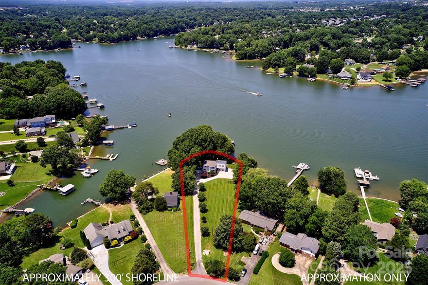 Your dream lakefront opportunity awaits on this exceptional 1.25-acre peninsula-style lot with over 300 feet of pristine Lake Norman shoreline. With deep water access, mature trees, and expansive long-range views, this double-waterfront parcel is a rare find. Just minutes from the interstate and benefiting from low Iredell County taxes, the setting is as convenient as it is stunning.
Whether you renovate the existing home or build a new design, the possibilities are endless. Zoning approval for a detached accessory dwelling unit (ADU) is already in place, offering added flexibility for guests, family, or potential rental income.