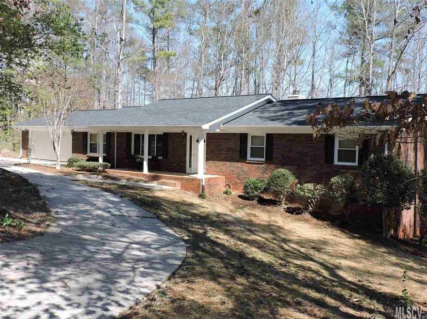 Renovated Brick Ranch house with full basement! New architectural roof, fascia, gutters, most windows! New back deck, new flooring, and heat pump. 3 Bedroom 2 bathroom home. Large kitchen with lots of cabinets and a very nice wood burning fireplace.  This kitchen can fit a huge table and chairs. Also has a formal dining room. The basement has been plumbed for a bathroom, kitchen and laundry room.  Lots of windows in basement. Can easily be made in to a large play room/family fun area.  Area is very pretty, mature landscaping. Convenient location to town and groceries. Double car garage adjoins kitchen. Laundry room on main level.  Very reasonable utilities. Come and take a look!