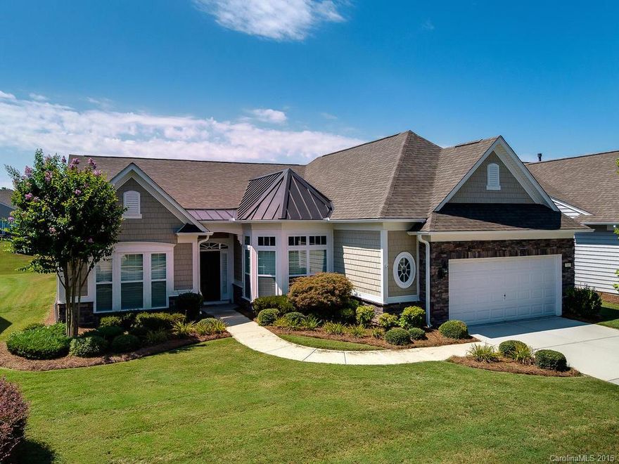 Move-in ready Cumberland Hall with Sunroom on a premium lot near the end of a non-through street makes this one of the finest available. New hardwood flooring and carpets! Split bedroom plan offers great living features.  Custom Plantation shutters, roll-out shelves in kitchen, master closet system, drop zone in mud room, floored attic over most of oversize garage.  Backs up to large Common Area w/ custom brick paver patio and sitting wall plus added landscaping.  Full irrigation. New roof 2012.