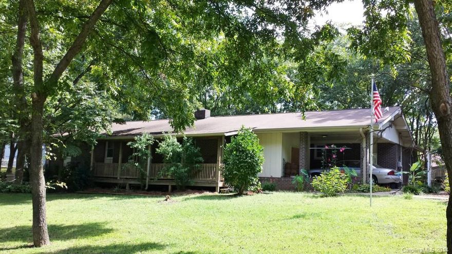 Enjoy your morning cup of coffee on the private covered patio surrounded by shade trees.  This ranch on over 1/2 acre also features an updated kitchen, hardwoods in the great room and den, and plenty of room for entertainment.  The 4th bedroom and 3rd bath have electric baseboard heat & a window unit- permit status of this area unknown.