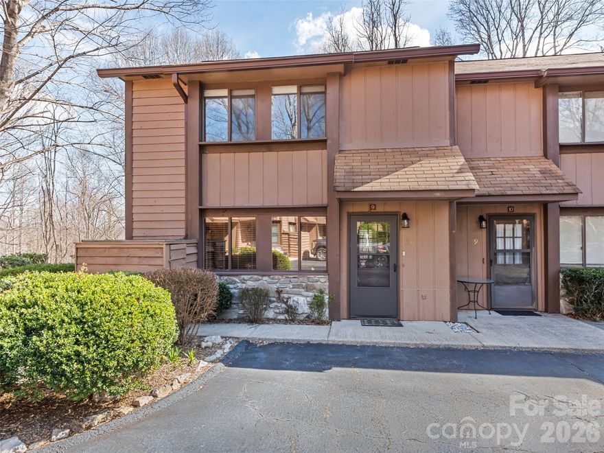 Nestled in the heart of Maggie Valley, this exceptional end-unit townhome offers a bright and airy mountain escape that is perfect for year-round living or a second home.The main level is anchored by a beautiful rock wood-burning fireplace, creating an inviting space for cozy evenings. This level also features a kitchen with freshly refinished cabinets and tile countertops, opening to a dining area and a living room with a unique picture window—the only one of its kind in the neighborhood. A convenient half-bath and a large walk-in storage closet complete the first floor.The upper level serves as a private sanctuary, housing a primary bedroom with a full bath and two comfortable guest bedrooms served by a second full bath. The primary ensuite is a true highlight, opening onto a balcony where you can take in panoramic mountain views during the fall and winter and enjoy the comfort of being hugged by nature in the spring and summer months. Located as an end unit, the home provides easy access to the spacious level commons area, offering a quiet sanctuary to enjoy the fresh air and mature landscaping. This impeccably kept townhome is a rare find that perfectly captures the tranquility of Maggie Valley, with the added peace of mind that no rentals are allowed in the community.