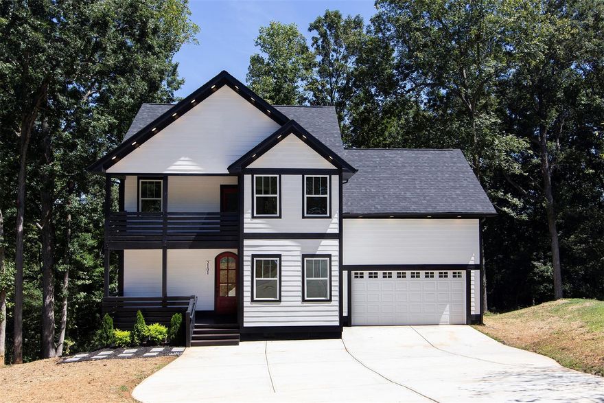 Fabulous new construction in great Charlotte location is a show stopper! Boasting almost 2600 square feet with 10 foot ceilings on main floor is just the beginning to what this home offers. Gorgeous floors, white kitchen cabinets w/ stunning counter tops, designer style backsplash, recessed lighting, stainless steel appliances & trey ceilings provide a luxury feel without the luxury price tag. Floorplan provides practical spaces such as a dining room/office, breakfast nook & breakfast bar. Generously sized primary bdrm & luxury bathroom w/separate free standing tub provide the perfect relaxing retreat. Two additional bedrooms on upper floor and full size bathroom provide ample space for a growing family. Bathrooms have mirrors that light with touch! Need additional space? Enjoy entertaining? This home has a bonus room w/built in bar. Grill connoisseur? Showcase your grilling talents on your rear deck. 5K seller paid closing costs when using preferred lender and full price offer.