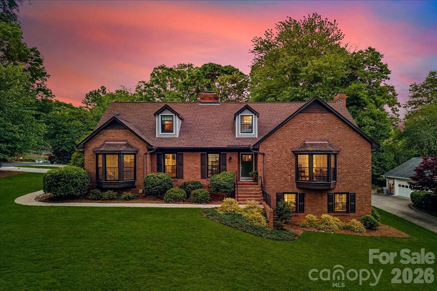 Located on a prime interior corner lot within Robinson Woods, this thoughtfully updated home offers a rare blend of comfort, function, and move-in readiness in one of Charlotte’s most established neighborhoods. Designed to be truly lived in, the home features spacious yet warm and inviting living areas, with each space offering flexibility and purpose for everyday living. The home includes a renovated kitchen that opens to the main living areas, creating an easy flow for both entertaining and daily life. With over 4,200 square feet, including a fully heated and cooled lower level, the floor plan provides excellent versatility for recreation space, a home office, gym, media room, or guest overflow. The lower level also features a fireplace and bar area. A newly constructed detached two-car garage adds both convenience and functionality. Outdoor living is intentionally low maintenance, with a private brick patio offering a comfortable setting for relaxing or entertaining. Well-positioned within the neighborhood and close to shopping, dining, and everyday conveniences, this home combines meaningful updates, flexible living space, and an inviting feel throughout.