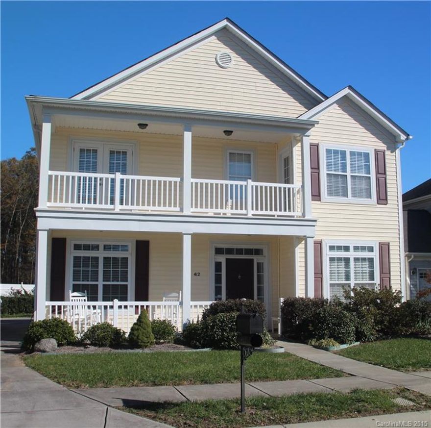 Rocking chair front porches! Beautiful hardwoods. Large Kitchen w/granite, lots of counter space. Master w/door leading to upper rocking porch, bright & open Master bath w/garden tub, separate shower walk in closet. Detached working/2 car garage, private backyard, Backs up to woods.  Great location, walk to downtown Pineville, close to I-485, Lynx, shopping and entertainment. Warranty included.