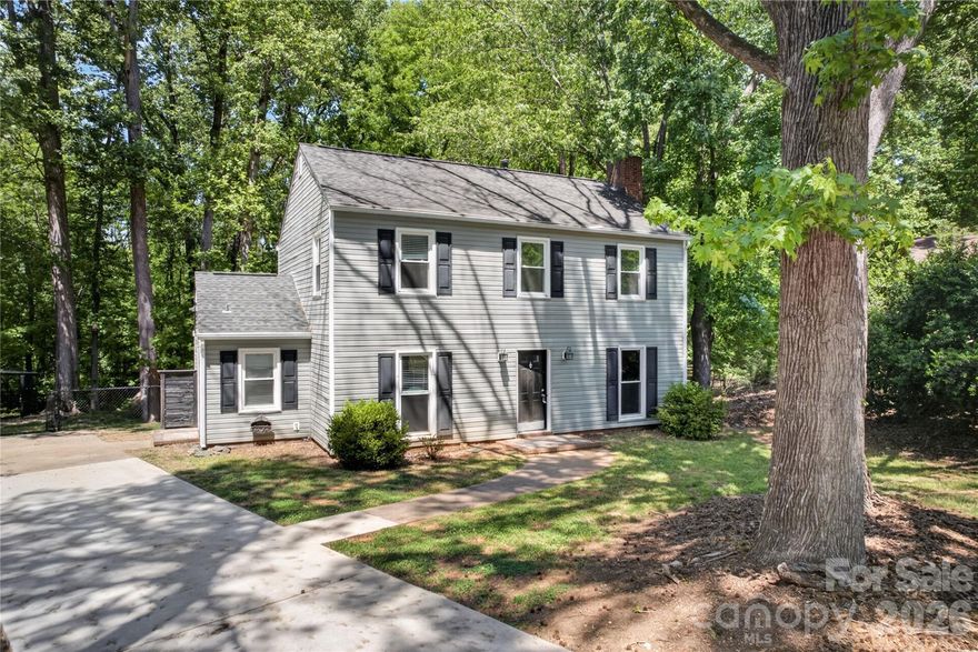 Situated on a premium cul-de-sac lot in South Charlotte’s desirable community of Sardis Woods, this 2-story home has been beautifully updated and is move-in ready.  Hard surface floors run throughout the natural light filled home.  Updated chef’s kitchen features ample refinished cabinets, granite counters, butcher block island, wall oven, four burner gas cooktop and exterior venting hood.  The great room is large and ideal for relaxation or entertainment with brick fireplace.  Flexible formal dining room could also function as a study.  The primary suite is expansive with double walk-in closets and en suite bath with renovated tile shower.  Bedrooms two & three are both generous in size with access to the updated full bathroom 2.  Relax on the oversized entertaining deck, complete with bench and pergola overlooking the enormous fenced backyard with direct access to McAlpine Greenway.  Conveniently located moments from premier shopping, dining and entertainment with a backyard like no other, this is truly a must see.