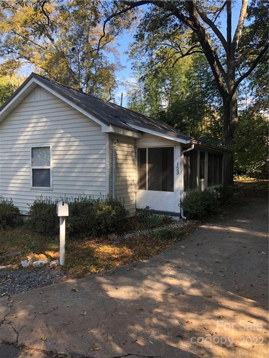 Cozy vintage cottage!  Lovely location with cul-de-sac, mature tree canopy, privacy.  Home has had some updates - new HVAC in 2020, metal roof in 2011, window upgrades.  Hardwood flooring in most of the home.  Ample parking, large screened porch.  So much potential in a great downtown location.  Walkable to downtown restaurants! This home is being sold "as-is".