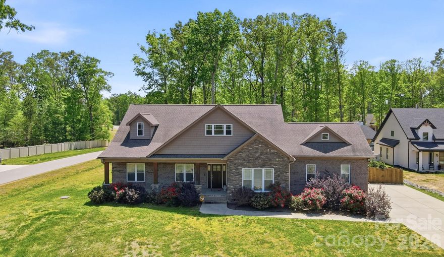 Stunning Custom Home in a Highly Sought-After Union County Community
Welcome to this exceptional, upgraded home offering the perfect blend of luxury, comfort, and functionality—all in the heart of Union County.

Step inside to an open-concept floor plan designed for modern living and effortless entertaining. The chef’s kitchen is a true centerpiece, featuring a massive island with breakfast bar seating, elegant pendant lighting, quartz countertops, stainless steel appliances, a gas range with double oven, custom tile backsplash, and an oversized custom pantry.

The kitchen flows seamlessly into a spacious living room anchored by a striking stone fireplace, while the formal dining area overlooks your private backyard retreat—ideal for gatherings both large and small.

The expansive primary suite offers a versatile bonus nook, perfect for a home office, reading area, or fitness space. The luxurious en-suite bath includes a beautifully tiled shower, dual vanities, and a large closet.

Additional features include two generously sized bedrooms with a full bath, plus a flexible fourth bedroom or 2nd Primary Bedroom is complete with its own en-suite bathroom and closet—perfect for guests or multi-generational living.

Save the Best for Last - outside to your personal backyard oasis. Enjoy a covered patio and open courtyard space with Firepit connected to the gas line. Unwind in the stunning saltwater pool with outdoor shower. The fully fenced yard extends deep into a wooded backdrop, offering both privacy and natural beauty.

Additional highlights include attic access from the garage with excellent potential for future expansion. Oversized 2 Car Garage with Side door to the Back Patio

Located in a prime area within the desirable Piedmont school district, this home truly has it all.