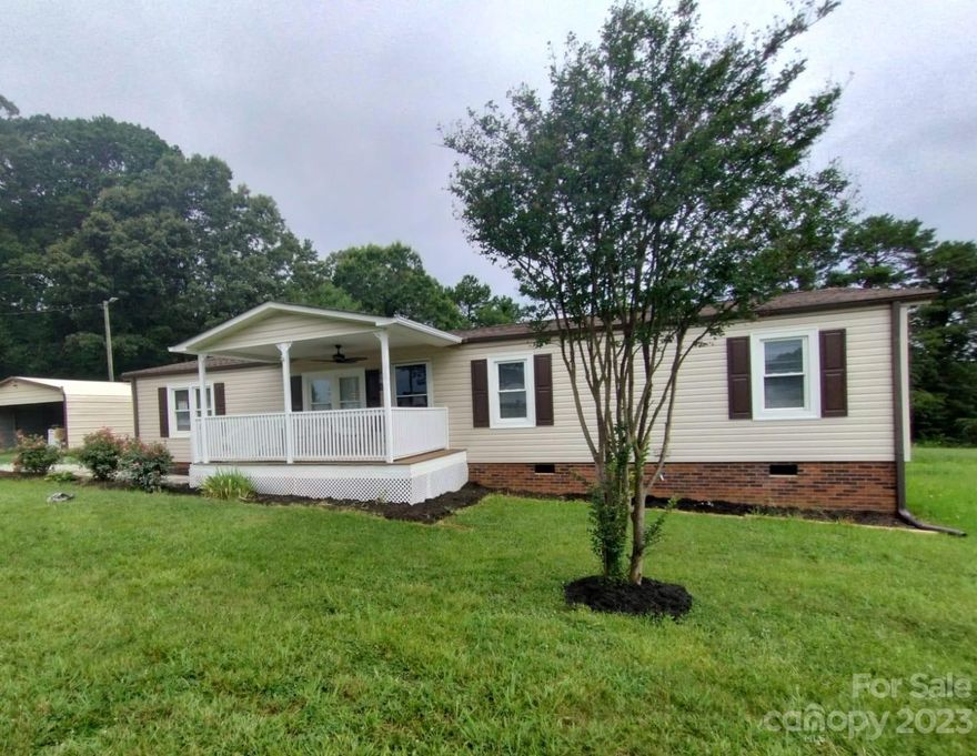 Almost 1 acre of flat land, convenient quiet location, 2 extra buildings (one with concrete floor). 4 bedrooms! Back on the Market at no fault of seller.