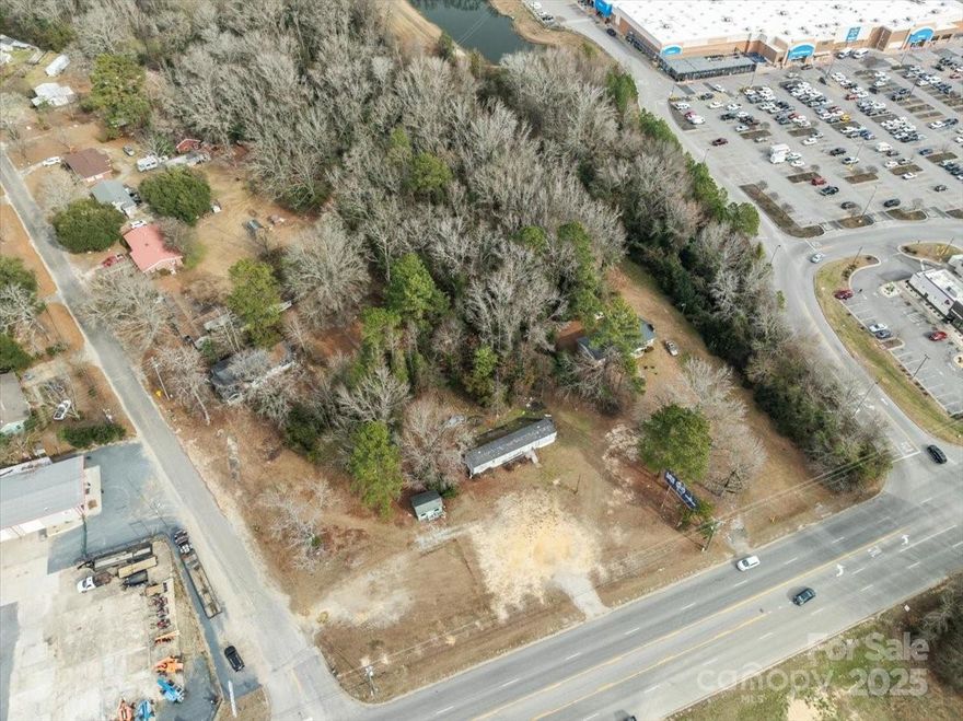 Take a look at this opportunity! With over 2 acres of land. This property on Highway 9, situated between Walmart and Northeastern Tec is conveniently located and easily accessed. The corner lot has access from Highway 9 with approximately 215' of access and also Isgett Rd. It could be used as a residential lot or for a business location. There are a couple of small structures on the property which may convey.